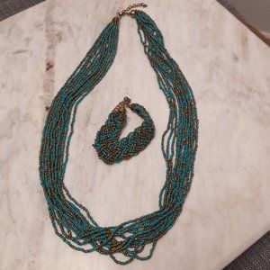 Turquoise and gold multi layer beaded necklace and bracelet.